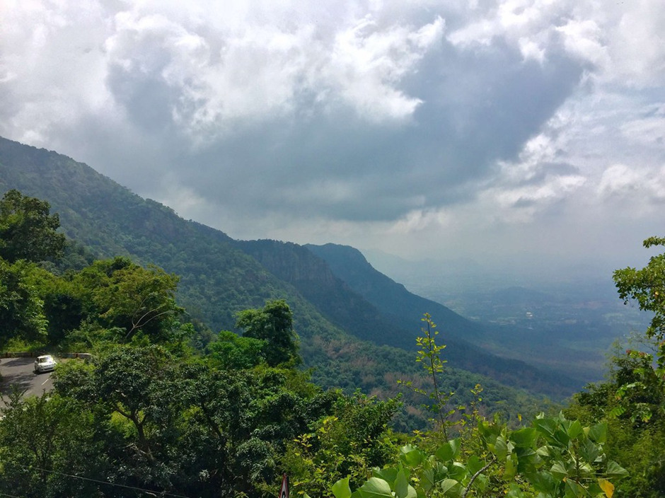 Yercaud Hill Top Curve Viewpoint with panoramic views of winding roads, misty valleys, and lush green hills