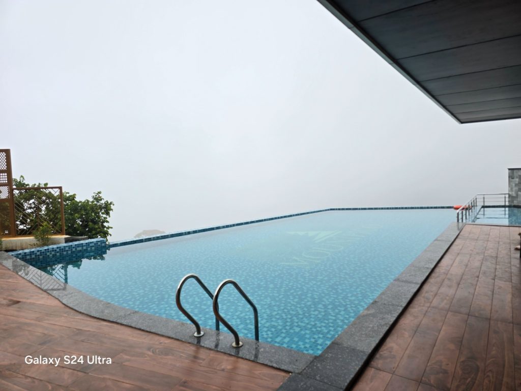 Stunning infinity pool at Mount Pico, Yercaud, overlooking misty hills and lush greenery